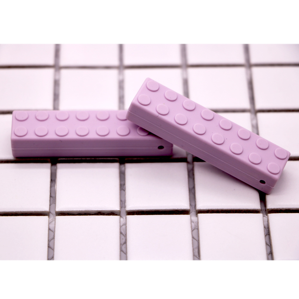 Bloques de construcción de silicona fabricantes de mordedor niños bloques de construcción de ladrillo de silicona teether sensorial masticar colgante bebé teether stick