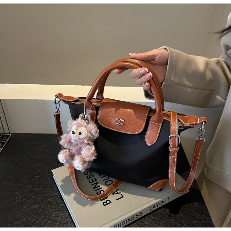Nylon color contrastante empalme bolso de bolsillo portátil mujer 2024 nuevo estilo transfronterizo de alta calidad exquisita mochila de hombro