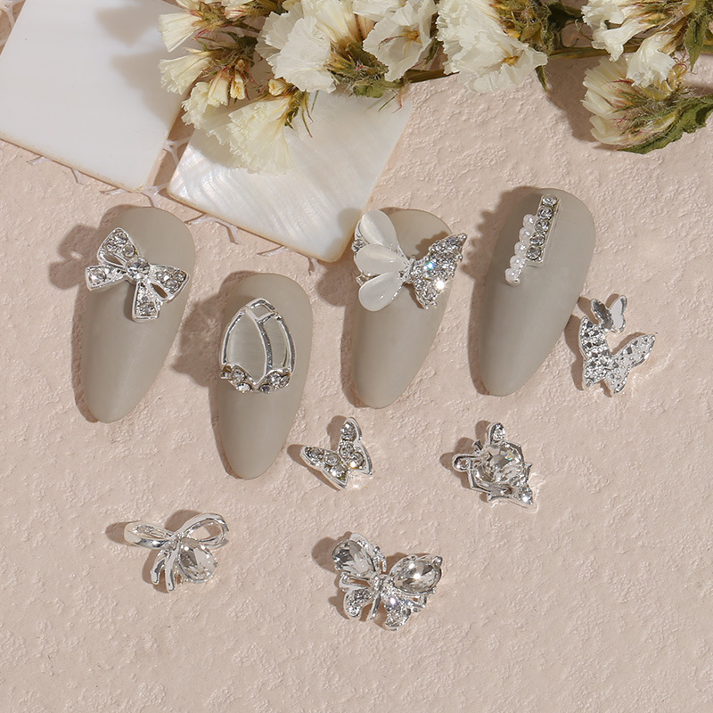 Transfronterizo nueva manicura mariposa plata metal aleación plana estilo japonés Internet celebridad rhinestone DIY accesorios joyería al por mayor