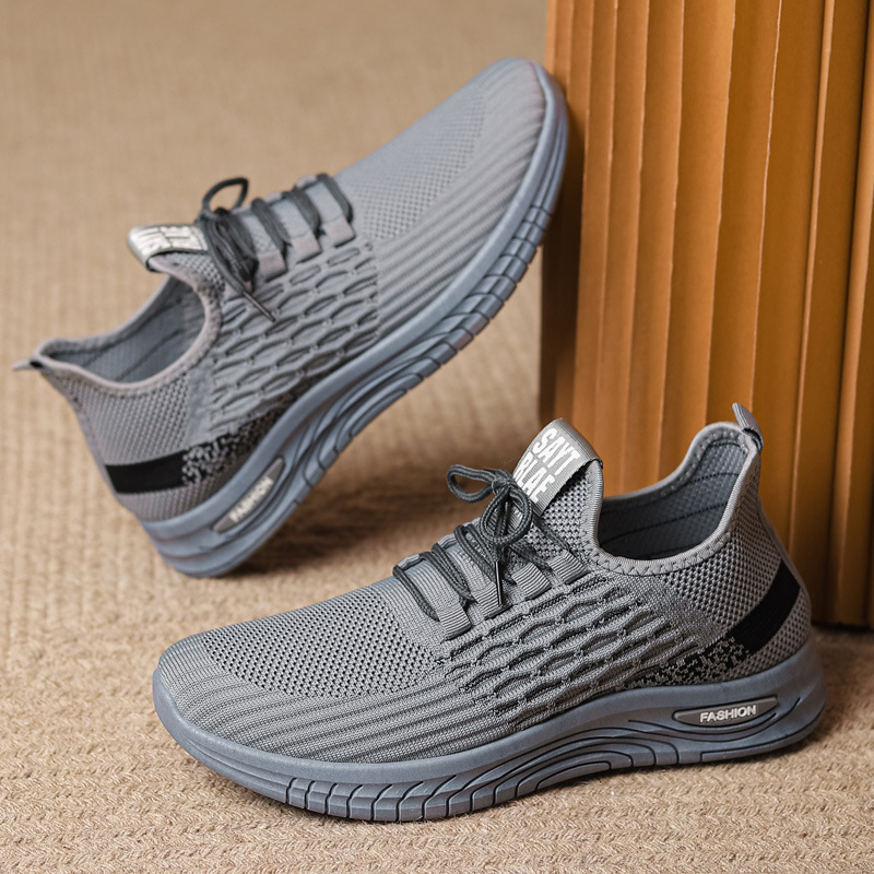 Nuevos zapatos de hombre transfronterizos primavera y otoño transpirables delgados deportes ociosos para correr tejido anti-deslizante hueco zapatos de moda comercio exterior