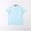 Cotton polo light blue yellow label