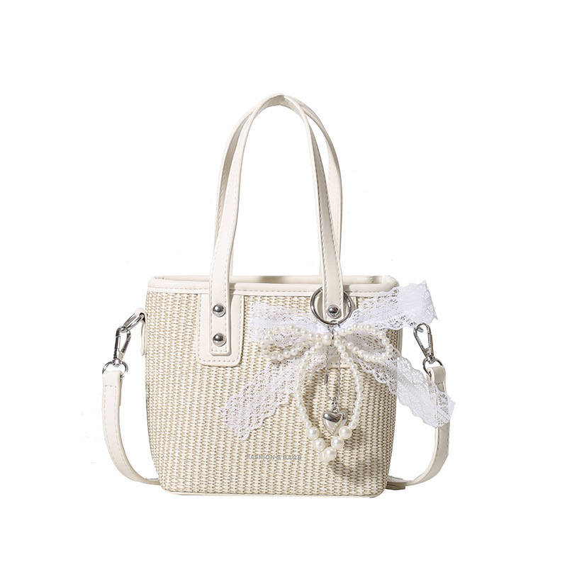 Bolsa de balde de mano caliente de verano para mujeres 2025 nueva bolsa de playa de vacaciones de playa bolsa de tejido bolsa de paja