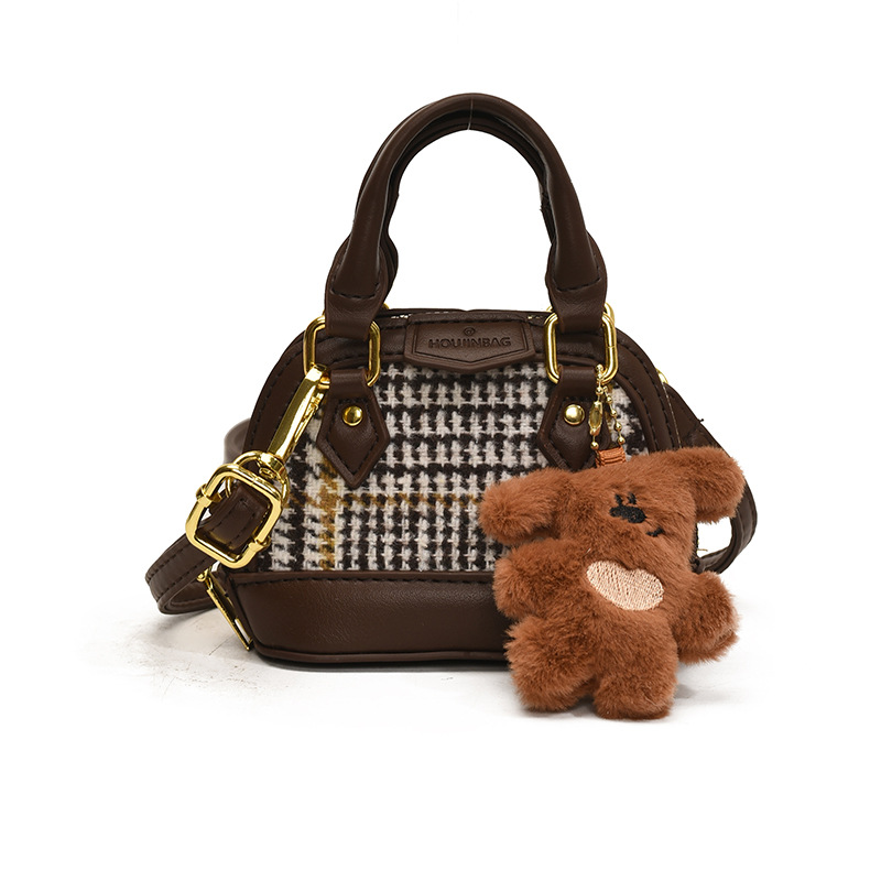 Mochila de moda de leopardo para niñas, mini bolso de concha portátil para bebés, 2025 nuevo bolso de comercio exterior para niños