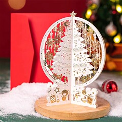 新しいクリスマスの立体グリーティングカードのレーザー紙の彫刻と金の水晶の玉の装飾の置物のメッセージカードの3dの雪のボールの置物