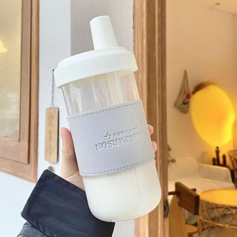 ミルクティープラスチックカップには個性的な英語の断熱カバーが含まれています。真珠を吸うことができるプラスチックカップです。|undefined