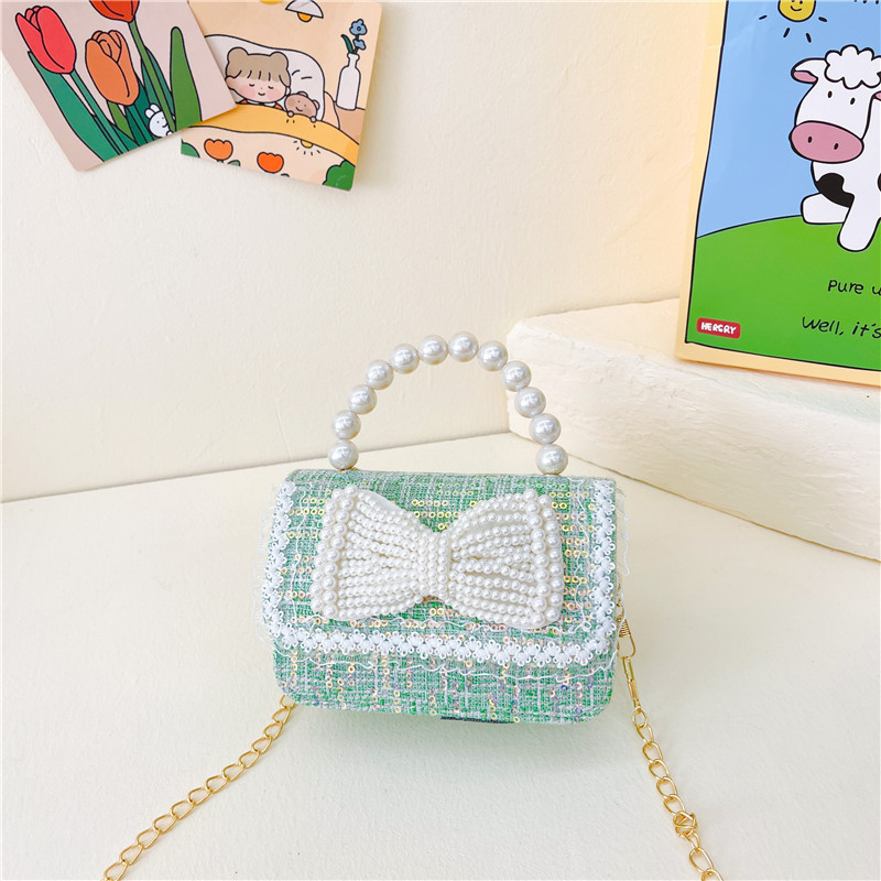 Nuevo bolso de los niños al por mayor Chunxi nuevo arco accesorios bolsa niña fuera monedero crossbody bolsa