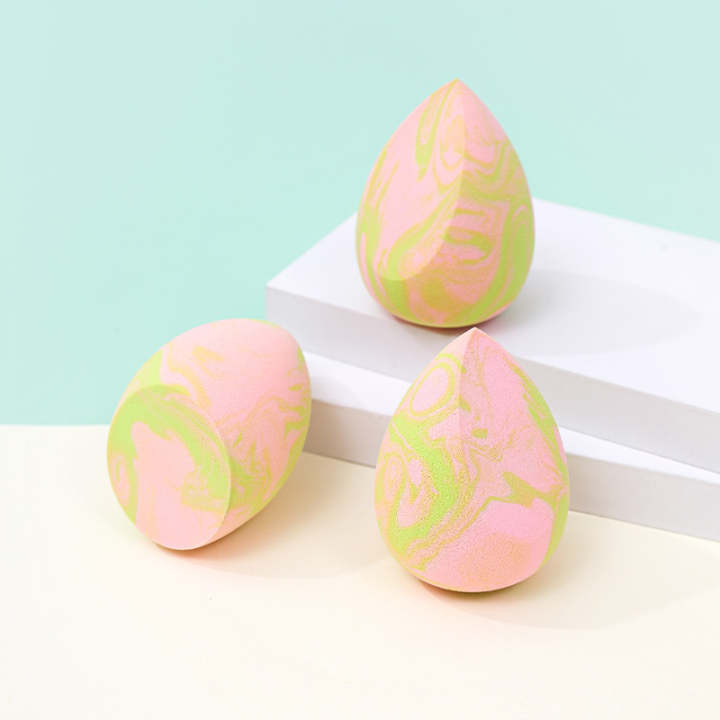 La borla de polvo de huevo de belleza de color mixto transfronterizo se agranda cuando se encuentra con el agua, gotas de agua sin látex, esponja de maquillaje en forma de calabaza, personalización de fábrica de huevos