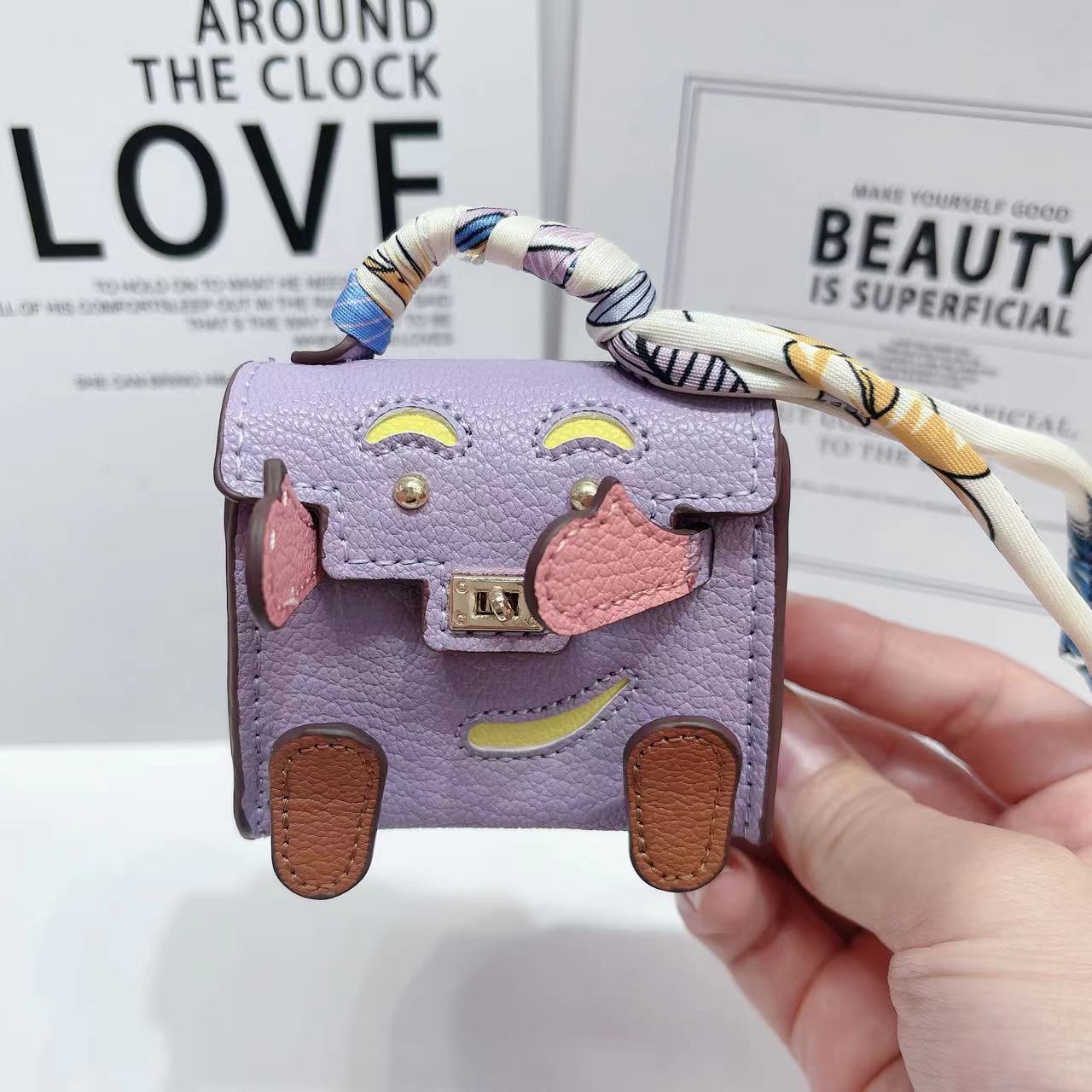 Lindo mini bolso de muñeca Kelly personalidad de nicho auricular Bluetooth inalámbrico bolso universal colgante pequeño premium marca de moda mujer