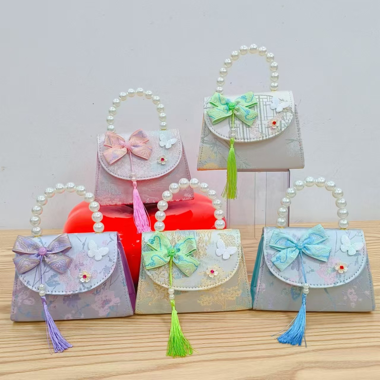 202 nuevo arco de estilo nacional bolsos para niños pequeños bolsos de moda de perlas de moda princesa bolsos de mano inclinados