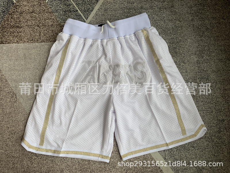 Comercio exterior pantalones de fútbol al por mayor Warriors Lakers 76 caliente Raptor mágico bolsillo bordado pantalones cortos pantalones de baloncesto NFL