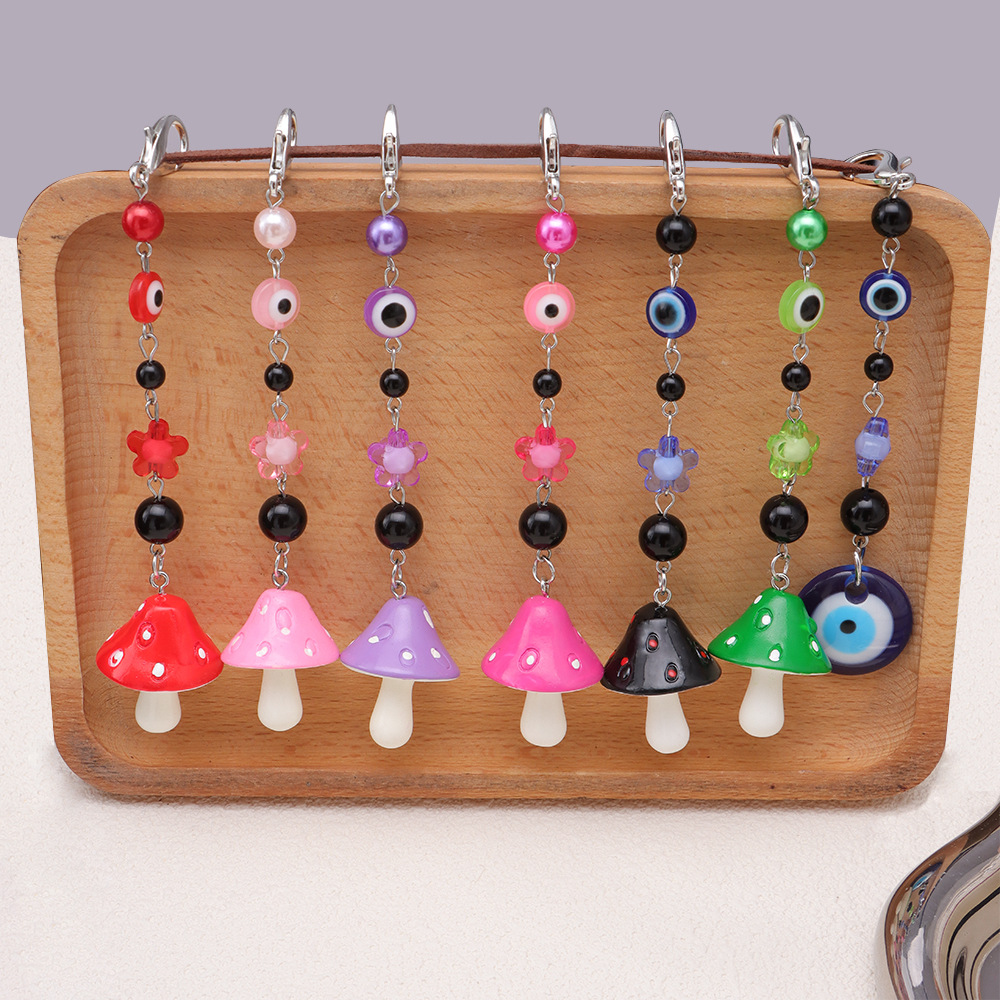 La versión coreana transfronteriza de la joyería de llavero de setas de color, la resina de dibujos animados, el ojo creativo del diablo, el bolso, el colgante de accesorios