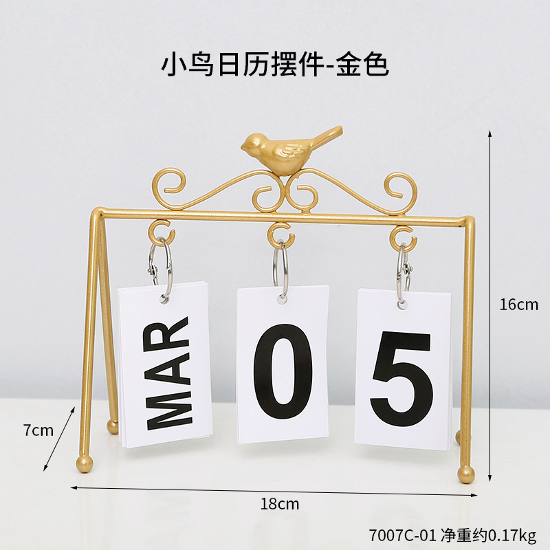 Adornos del calendario dorado del pájaro