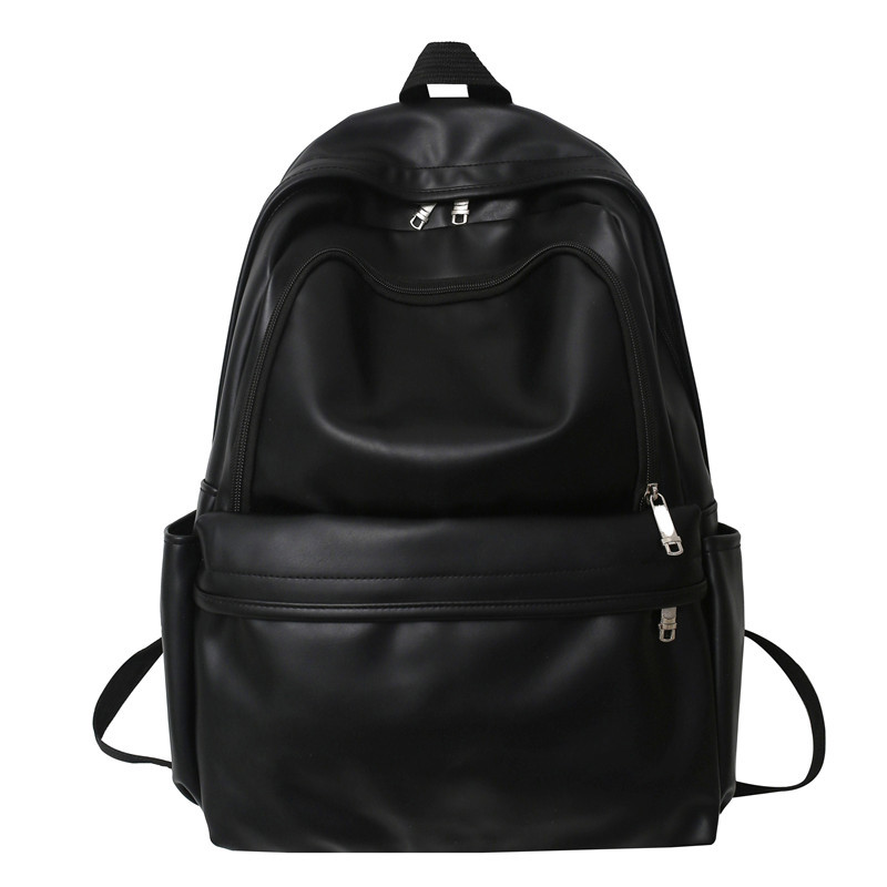 Comercio exterior nuevo estilo cuero suave gran capacidad color sólido escuela de secundaria mochila de moda masculina todo fósforo mochila simple japonesa