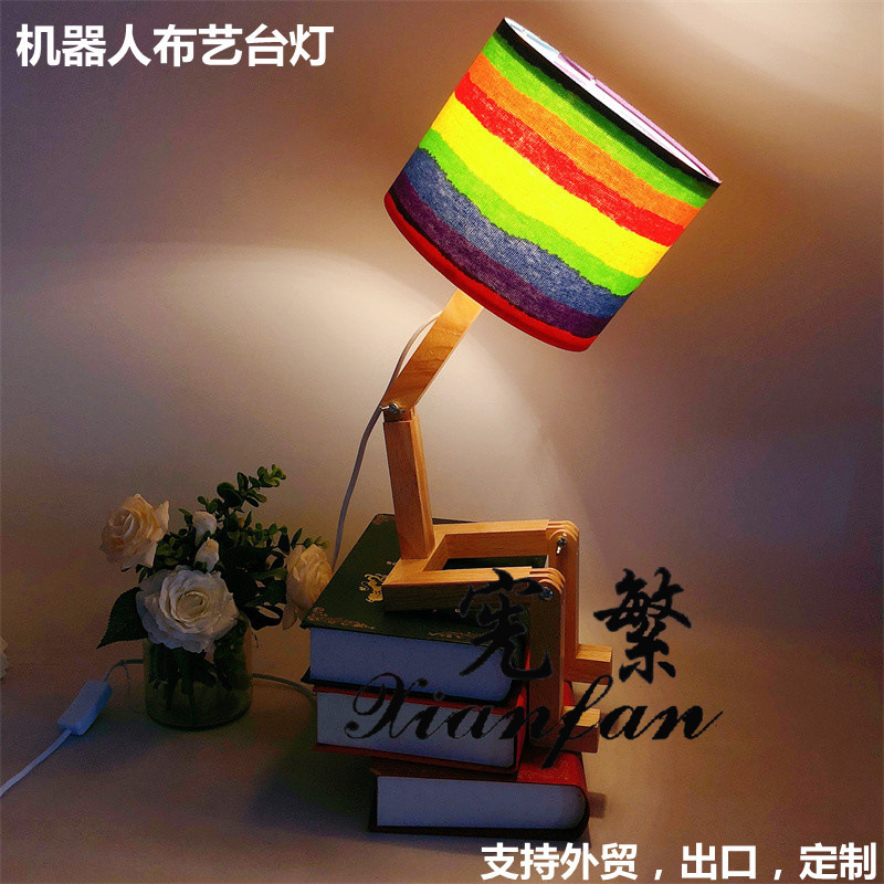 Robot creativo transfronterizo plegable dormitorio habitación escritorio lámpara de mesa decorativa tela de madera forma variable lámpara personalizada