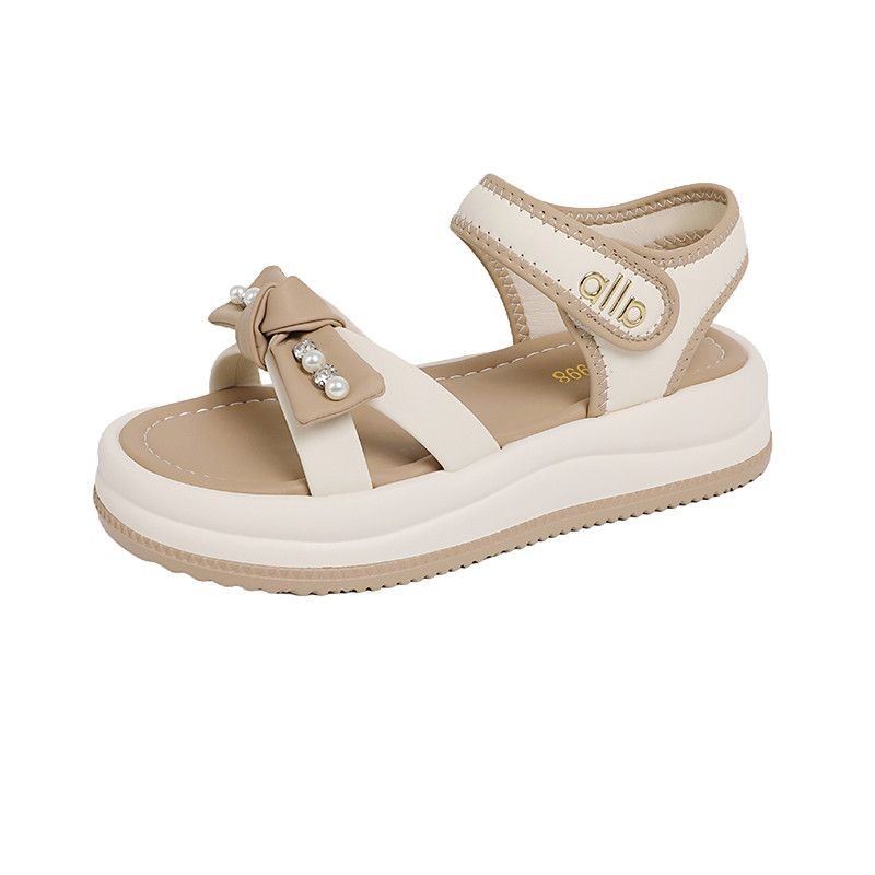 Temperamento de red de fondo grueso de moda para sandalias de exterior para mujeres verano de 2026 nuevo estilo coreano de playa ligera sandalias romanas