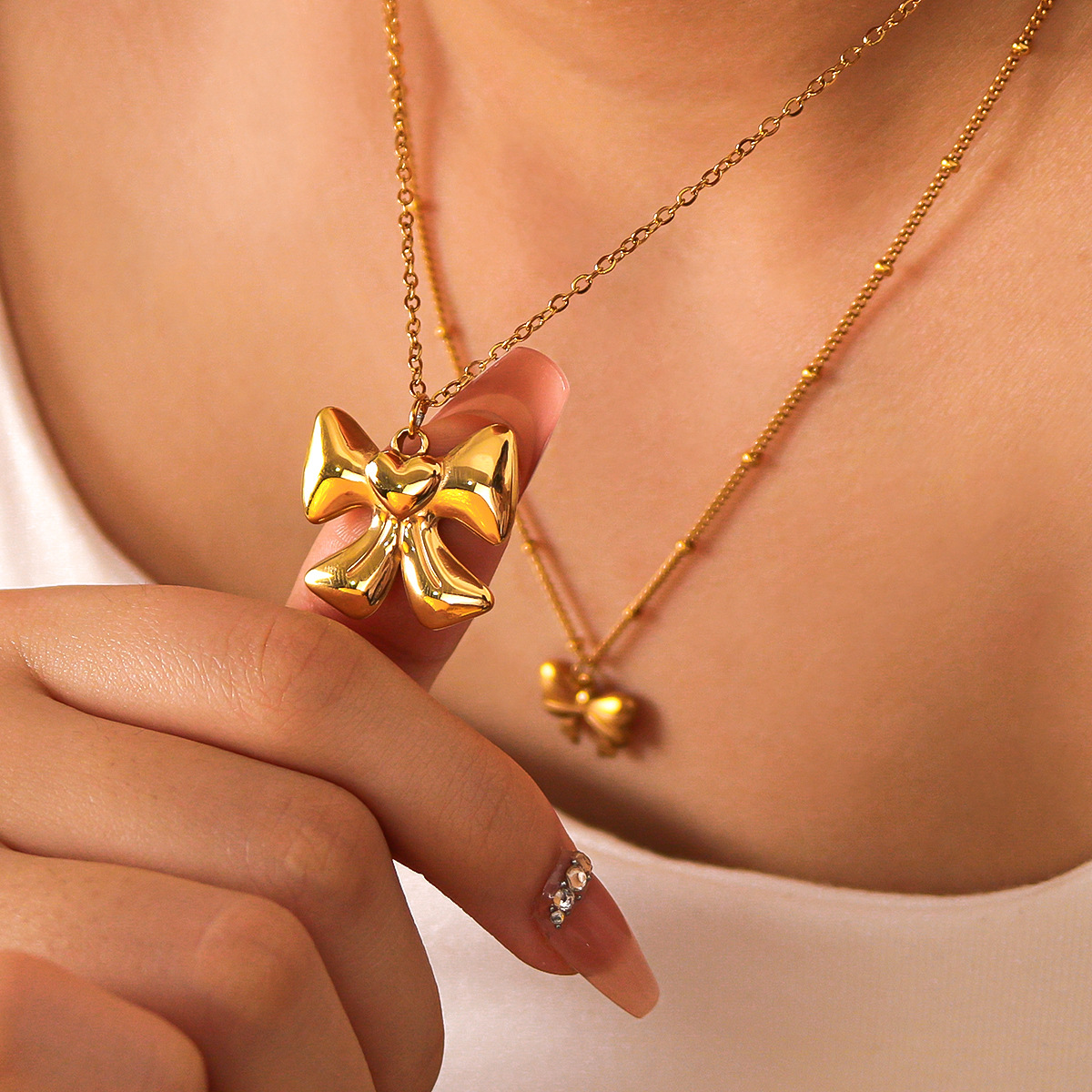 Fashionable geometric design pendant stainless steel with bow