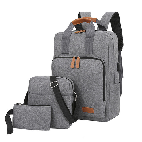 New three-piece backpack set Korean style travel bag computer backpack USB middle school student school bag manufacturer