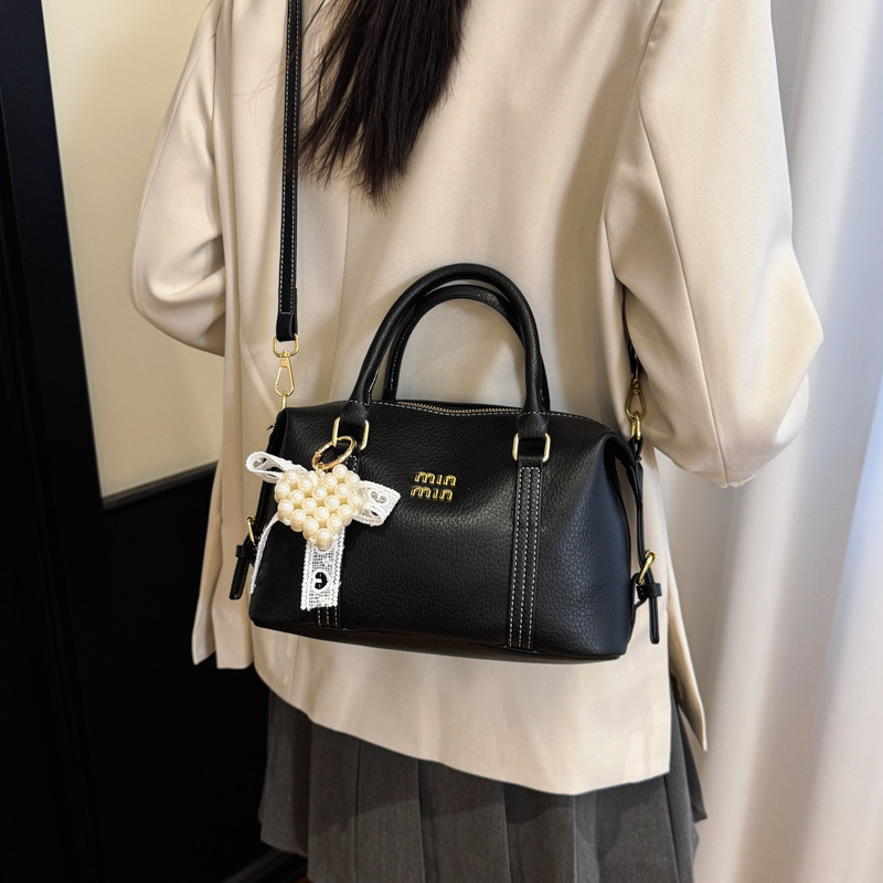 2026 nuevo bolso de bolos de mano de mujer simple sensación cotidiana de nicho de viaje coreano bolso de mujer bolso de almohada