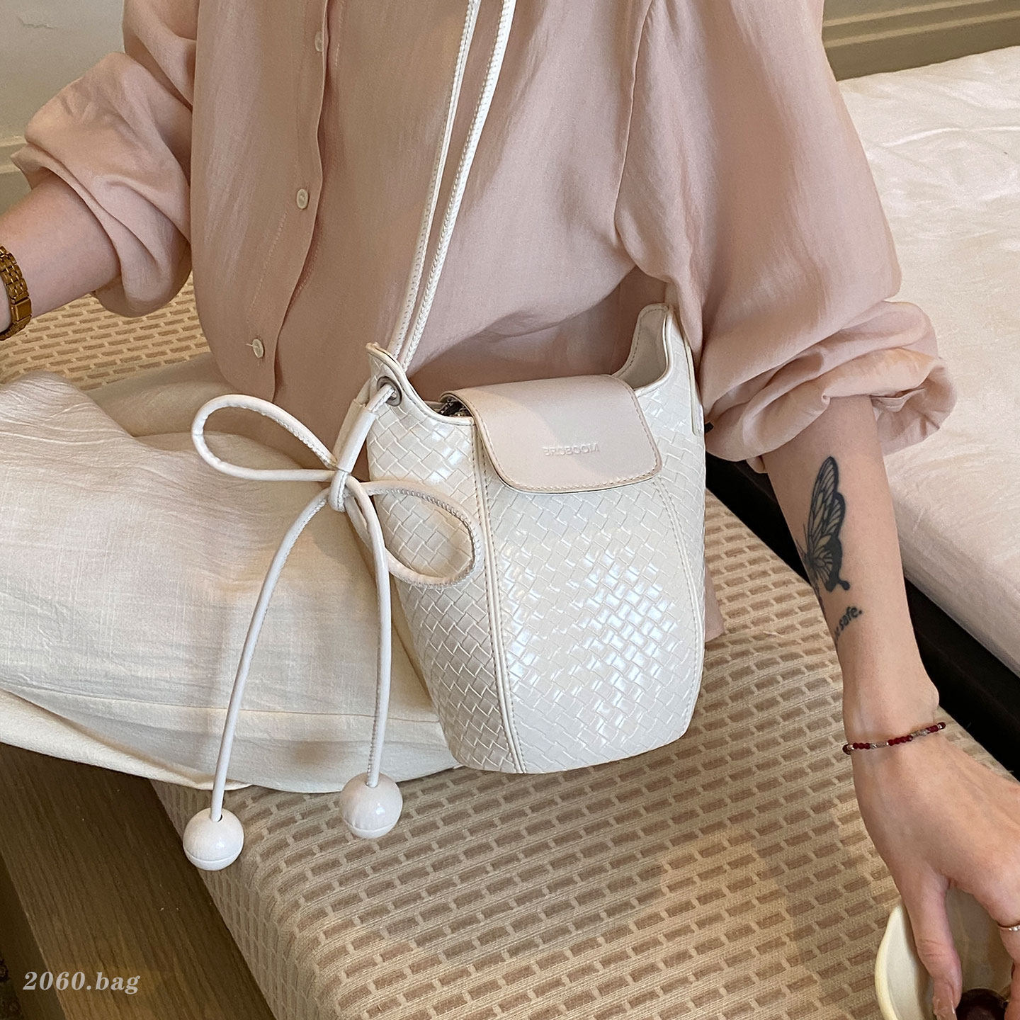 Nuevo hombro único sensación de cubo de agua de teléfono móvil tejido exquisita bolso de mujer mochila casual verano 2026