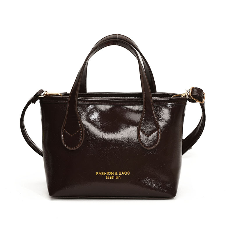 Bolso de cubo de textura de color sólido para mujer 2025 primavera nueva moda bolso de mensajero coreano estilo occidental de alta gama para mujer