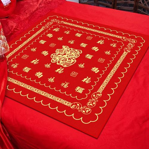 Bride sitting on the fortune cushion, the bride's side presents the auspicious bedding, wedding room decorated with hundred fortune cushions, wedding bed with red auspicious cushion.