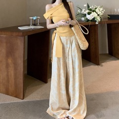 韓国スタイルの斜め肩ストラップデザインイエロートップ花柄スリムワイドレッグカジュアルパンツ女性のための 2025 夏スーツ