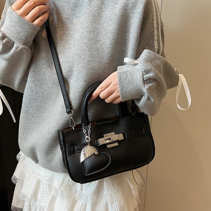 Alto sentido de lichi estampado bolso de mano Kelly2025 nuevo comercio exterior super caliente viaje bolsa de cubo de agua de moda bolsa de mochila versátil