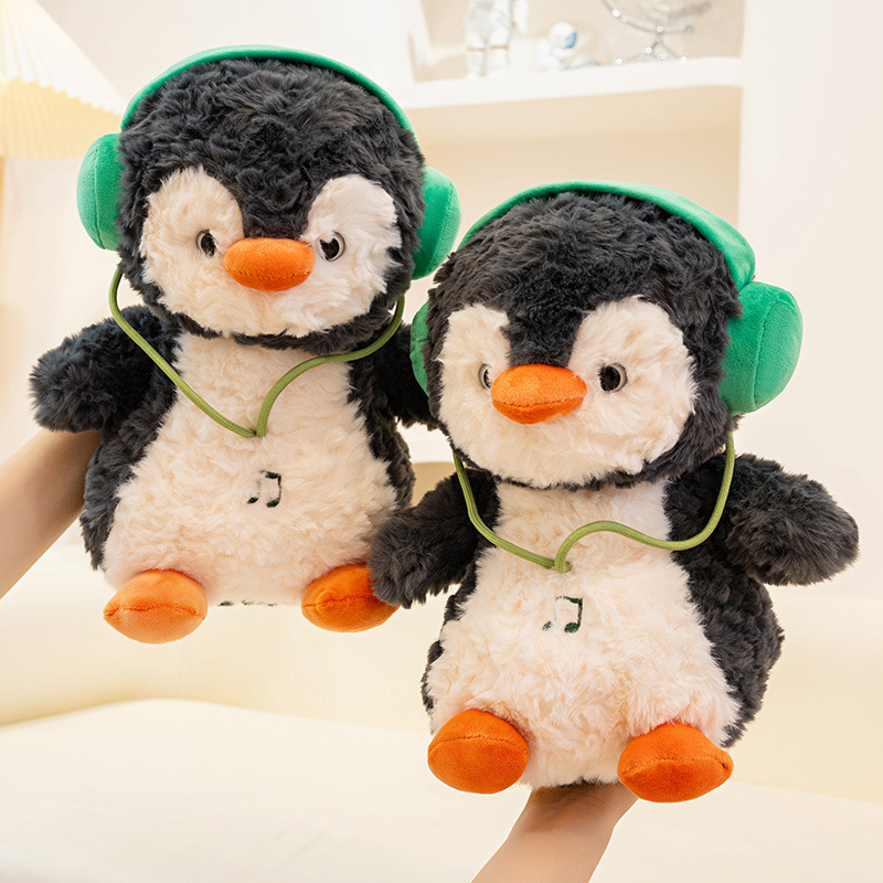 Muñecas de pingüino dinámicas transfronterizas auriculares muñecas de peluche muñecas de música muñecas de pingüino pacificador muñeca almohada