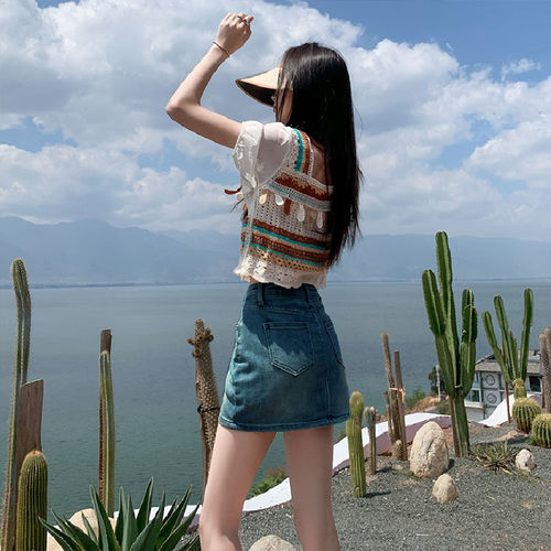 Leather-lined stretch denim short skirt for 2025, high-waisted, flattering for petite figures, showcasing a curvy silhouette.