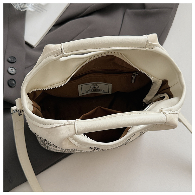 Summer fashion women's versatile hand-held niche crossbody design 2025 simple crossbody bucket bag, new Korean style for commuting undefined