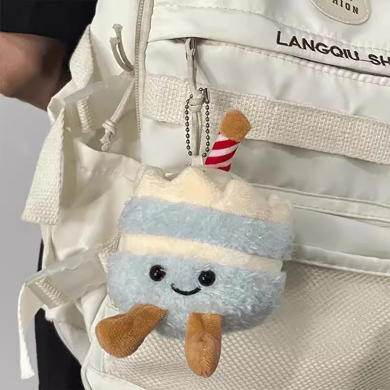 Pastel de peluche pequeño colgante lindo estudiante amiga bolsa de regalo extraña muñeca muñeca muñeca máquina de peluche lote