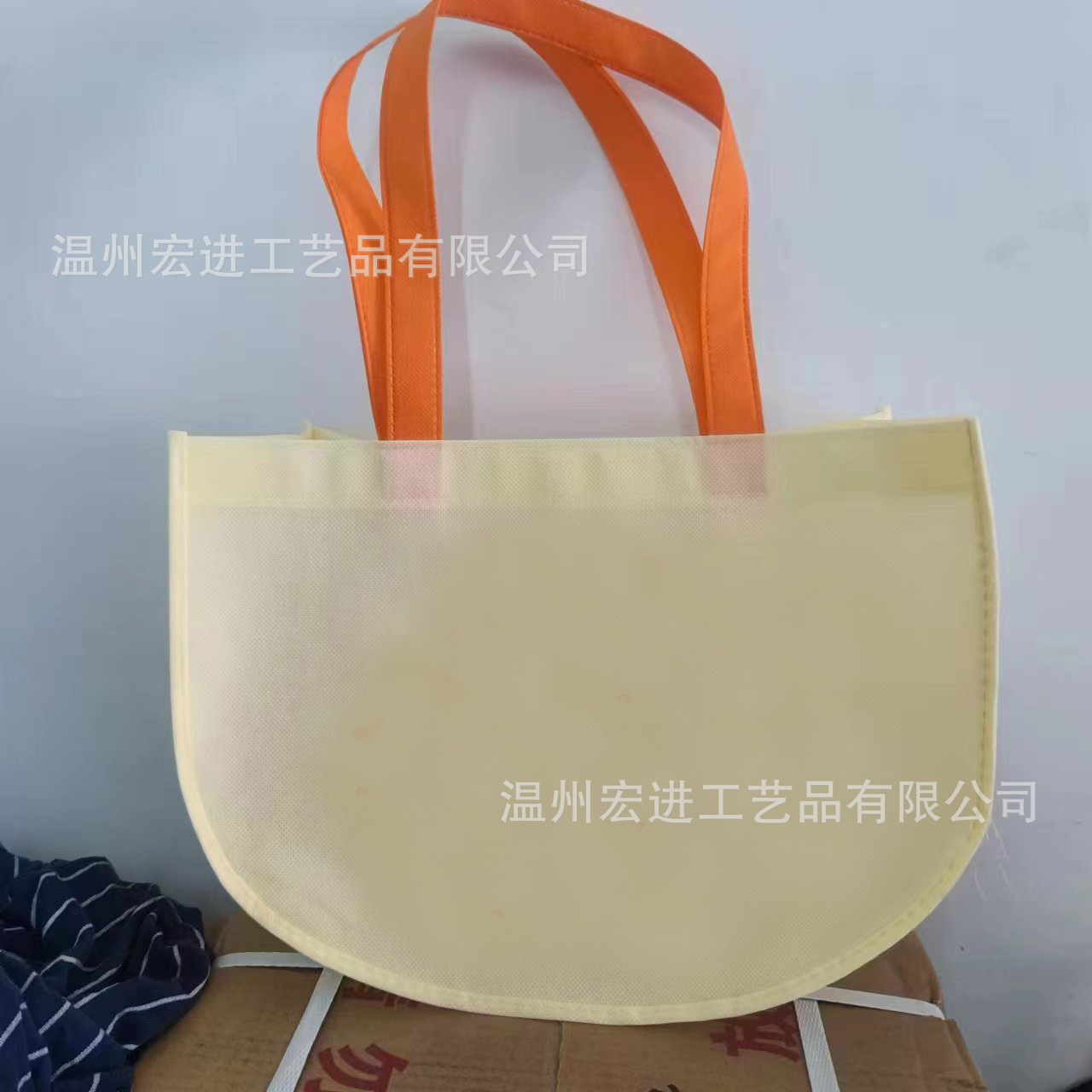 无纺布手提半月牙儿袋童装手提袋印刷logo服装手提袋广告宣传袋