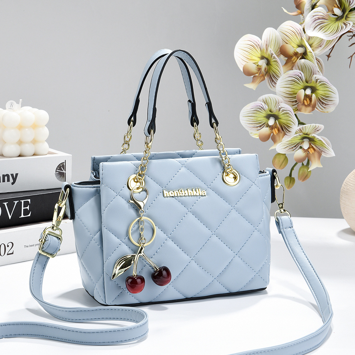 2026 nuevo estilo de fragancia bolso de mujer estilo de moda mochila de hombro de viaje versátil bolso de cubo al por mayor