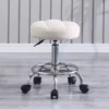 Creamy white round stool (pulsating wheels)