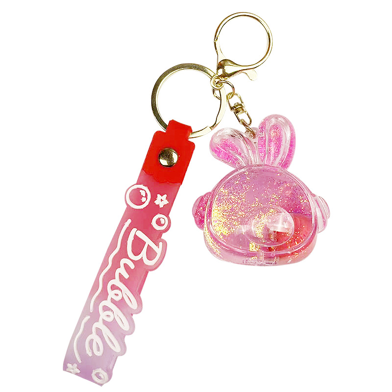 Botella de arena flotante de aceite flash fresas oso muñeca colgante llavero mochila para hombres y mujeres colgantes de automóviles pequeños regalos al por mayor