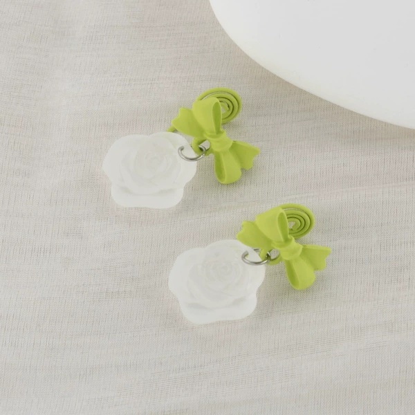 Green mosquito coil with bow contains rose, ear clips