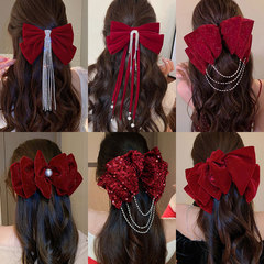 新年の赤いベルベットの蝶結びのヘアピンは甘くて高級感があります。