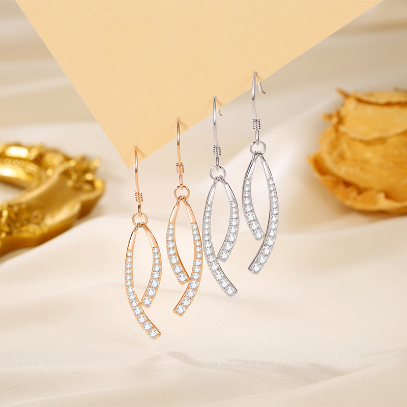 Pendientes de cola de pez cruzado francés 2024 nuevo estilo de moda de alta gama, temperamento de lujo ligero, pendientes de modificación facial de celebridades de Internet