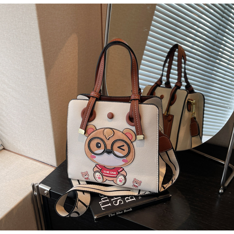 Bolso Tote transfronterizo para mujer de gran capacidad 2025 nuevo bolso bandolera de banda ancha salvaje de verano bolso de clase portátil de ocio