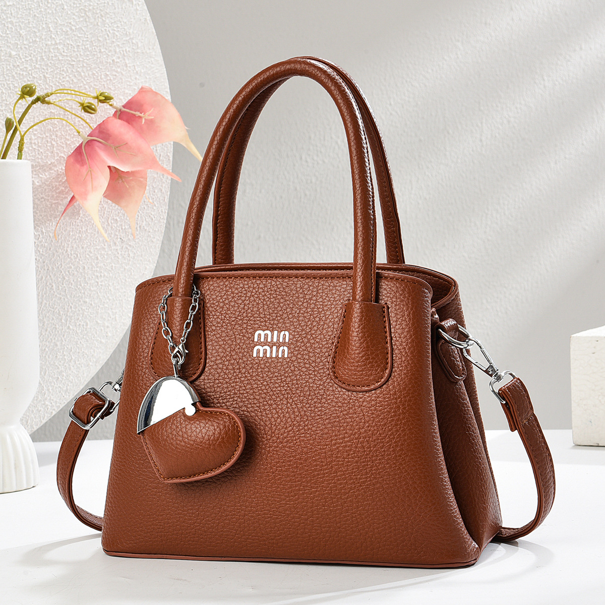 Regalo cálido bolso de mujer bolso de mano mujer 2025 nueva moda atmósfera dama de mediana edad enviar bolso de madre