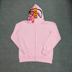 国境を越えた卸売りは外国貿易サメの頭の双帽黒粉のガーディアンの男女のカーディガンのジッパーのファッションブランドのカップルのコートを代行した