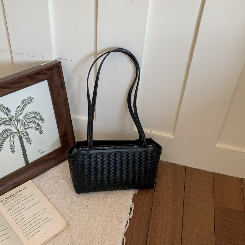 Moda fresca y alta capacidad trenzada bolsas axilales de nicho de nicho de diseño bolsas de mano diarias bolsas de viaje versátiles