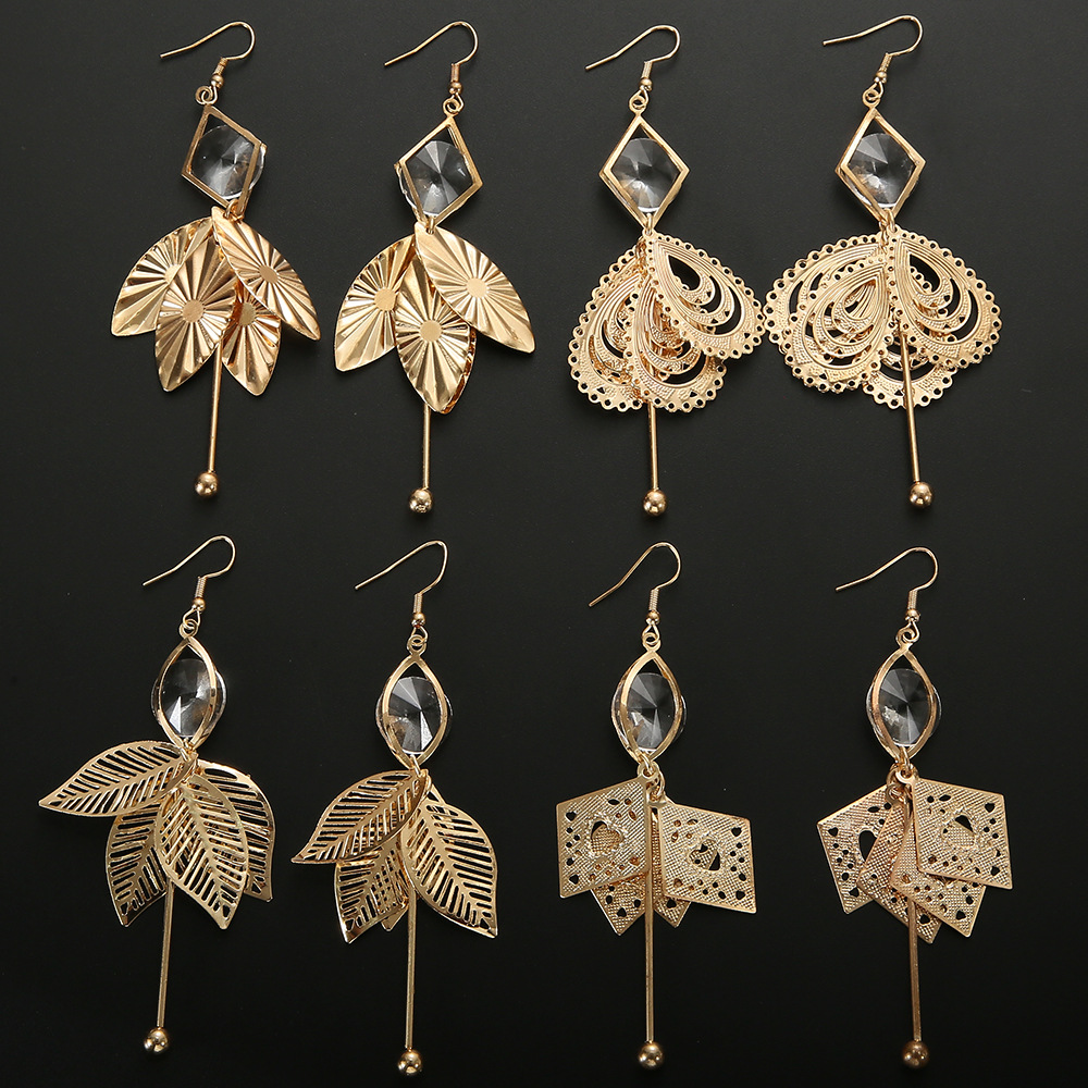 fashionable golden geometric earrings with tassels