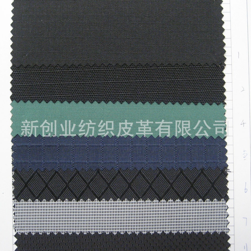 新品杂纹提花格子布料仿网布纹涤纶布大凌形格子布料箱包手袋布