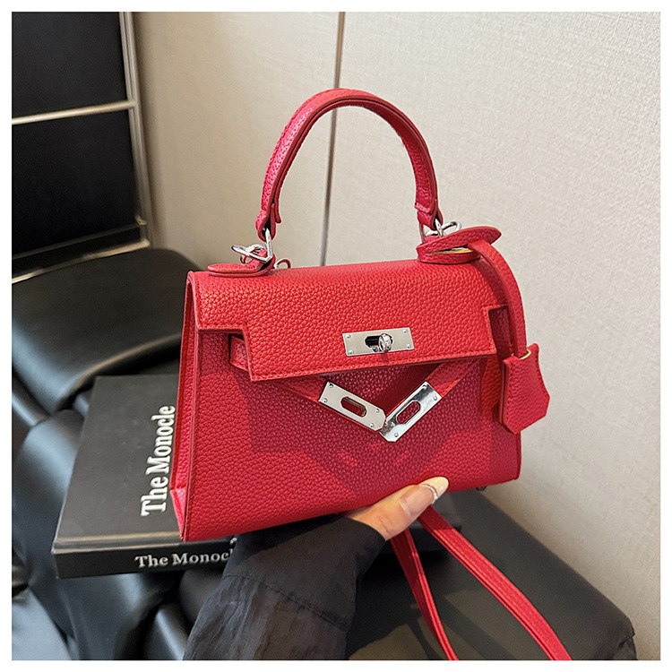 This year, a new women's casual summer single-shoulder crossbody bag with a niche design is in vogue. The hand-held small square bag is popular undefined