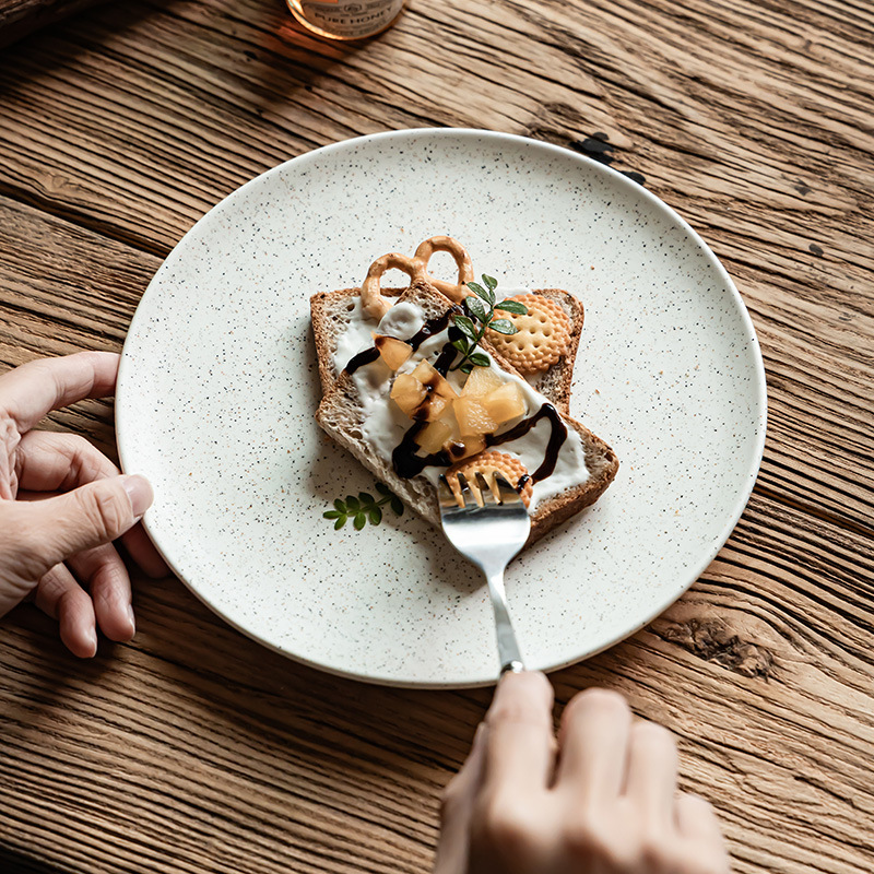 Plato de cerámica esmalte de sésamo retro platos de comedor occidentales platos de cubierta domésticos platos redondos al por mayor platos de postres platos de desayuno platos