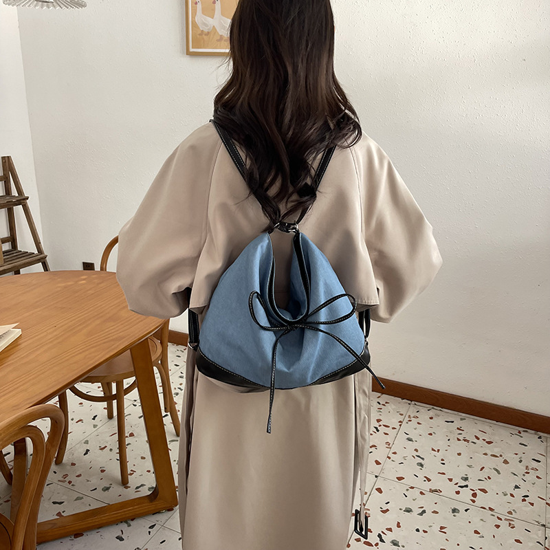 Bolsa de lona de nicho coreana para mujeres 2024 nueva moda de transporte de doble uso mochila de hombro universal
