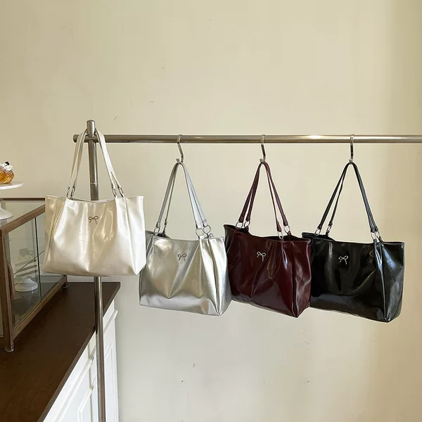 Retro large-capacity bow bag for women, 2026 new style, soft leather with a glossy finish, versatile tote bag for commuting