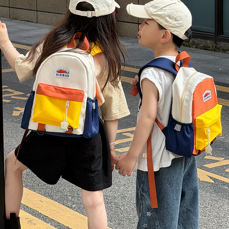 Jardín de infantes para hombres y mujeres, mochila de color extranjero, mochila de estudiantes de primaria de gran capacidad, 2026 nueva mochila infantil transfronteriza