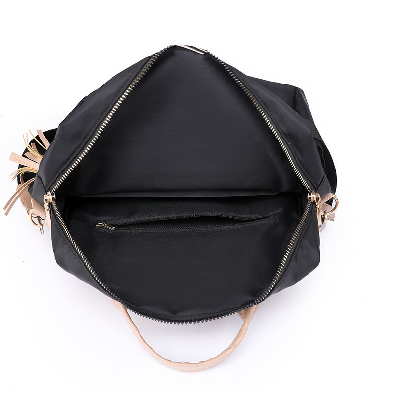 Fábrica al por mayor 2023 nueva versión coreana de la mochila de nailon para mujer moda literaria color de contraste viaje mochila de doble uso marea